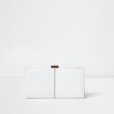 White laser cut metallic clip top purse